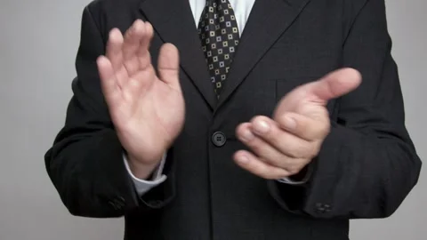 Man in a suit clapping slowly Stock Footage 243618887