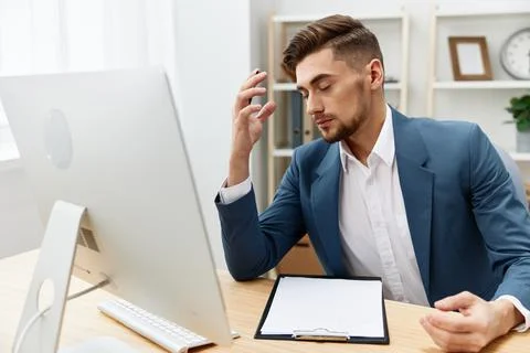 A man in a suit computer desktop work self-confidence paper folder isolated Stock Photos