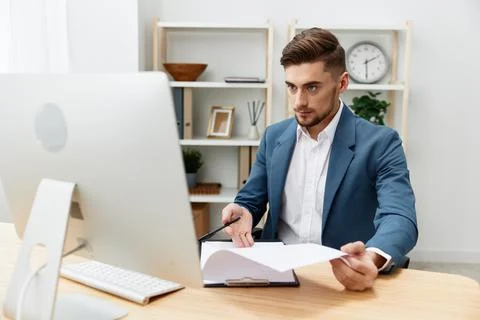 A man in a suit computer desktop work self-confidence paper folder isolated Stock Photos