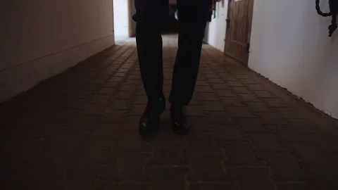 A man in a suit goes to the stable Stock Footage 129463620
