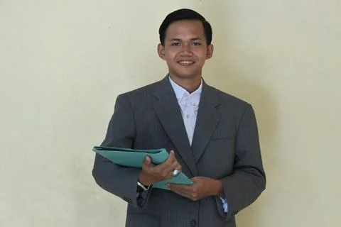 Man in suit holding isolated folder Stock Photos