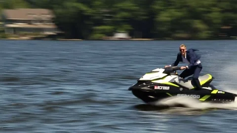 Man In Suit On JetSki Stock Footage 170718463