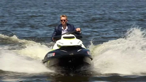 Man In Suit On JetSki Stock Footage 170718464