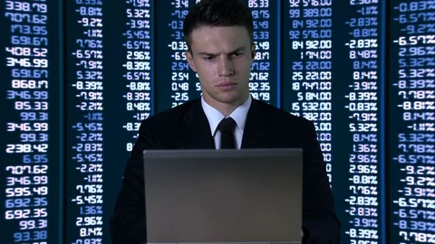 Man in suit with laptop, checking information on smartphone, digital data 库存影片 109186770