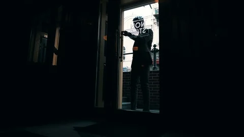 Man In A Suit Opens the Door and Enters the Dark Room Video stock 109449508