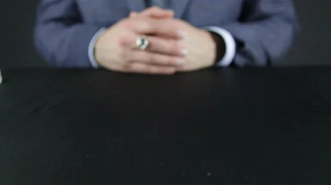 The man in the suit puts on the table packs of Euro Stock-Footage 56537377