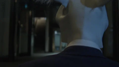 A man in a suit with rabbit mask from behind Stock Footage 259664596