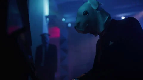 A man in a suit with rabbit mask playing a piano at the club 스톡 동영상 259045568