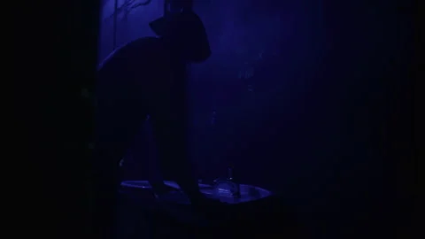 A man in a suit with rabbit mask using the bathroom sink and looking at the.. Stock Footage 259016229