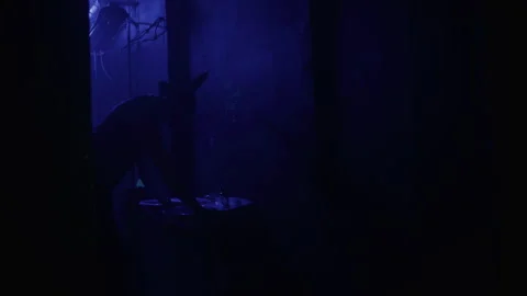 A man in a suit with rabbit mask using the bathroom sink Video stock 259017275