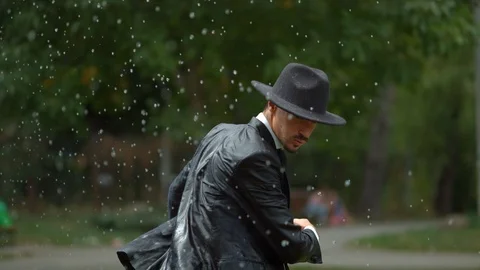 Man with suit in the rain, slow motion Stock Footage 86451438