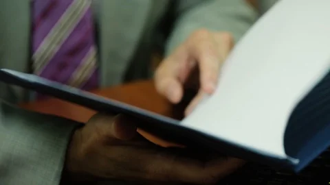 Man in suit reading documents Video stock 94496444