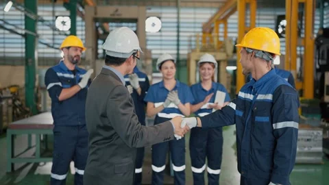 Man in suit shakes hand with worker Stock Footage 341925189
