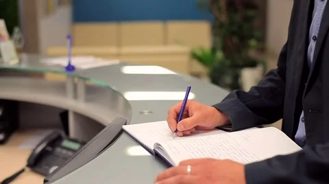 Man in a Suit Signs Documents in the Office Stock Footage 50994753