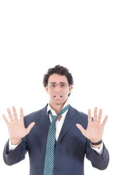 Man in a suit surrender with hid both hands Stock Photos