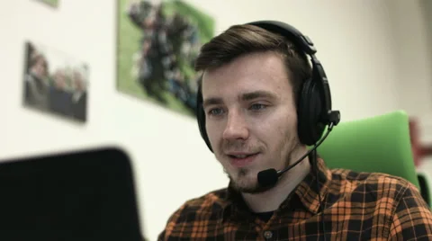 Man in suit using a headset while working in his office Stock Footage 65987392