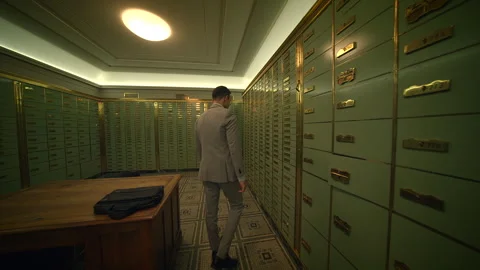 A man in a suit walks down a hallway in a building with a briefcase Stock Footage 274775661