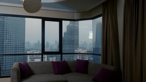 Man with a suitcase on the background of skyscrapers in a panoramic window Stock Footage 101435429
