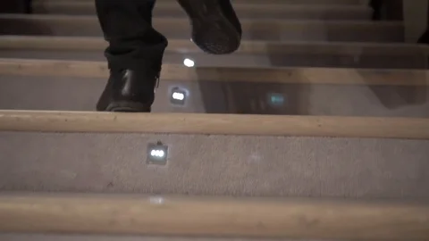 A man with a suitcase climbs the stairs Stock Footage 101691195