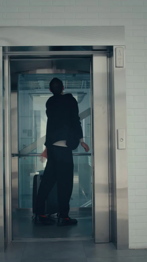 Man with Suitcase Dancing in Elevator Stock Footage 285831928