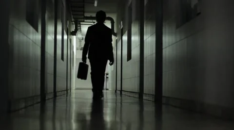 Man with suitcase walking along the corridor 02 Stock Footage 54782635