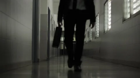 Man with suitcase walking along the corridor 01 Stock Footage 54782950