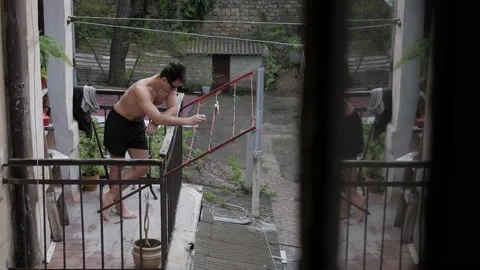 Man sunbathing on the balcony Stock Footage 194741835