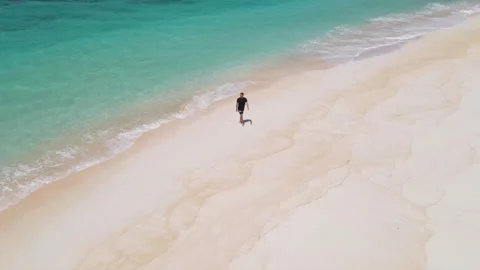 Man sunbathing on the beach Stock Footage 300660191