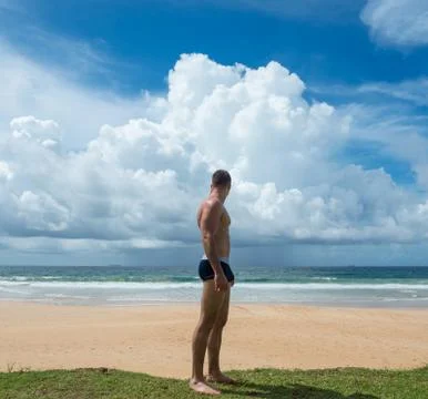 Man sunbathing on a beach Foto stock