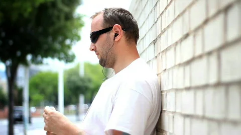 Man in sunglasses drinking water Stock Footage 751049