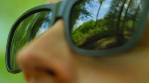 Man in Sunglasses Looking Around in Forest Close Up POV Stock Footage 111068302