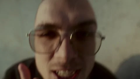 Man with Sunglasses Looking At Camera and rapping Stock-Footage 258275854