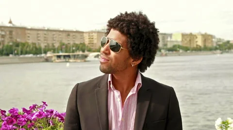 Man in sunglasses smiling at the camera Stock Footage 52009388