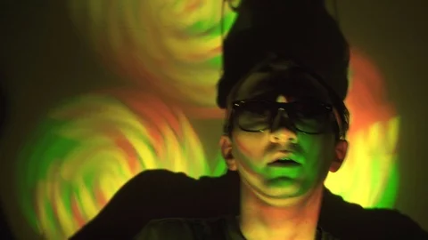 Man in sunglasses in the spotlight Stock Footage 71640888