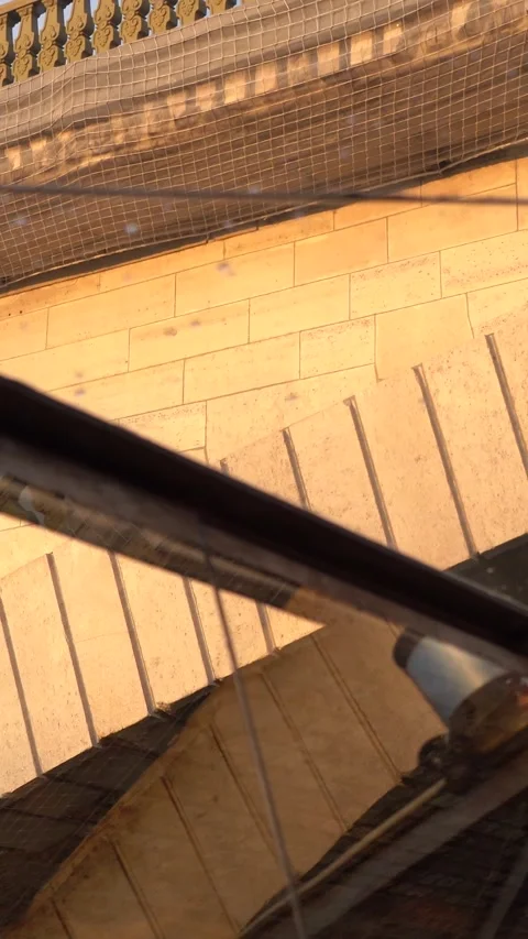 Man on Sunlit Bridge Seen Through Glass With Brick Arch Below at Sunset Stock Footage 334944392