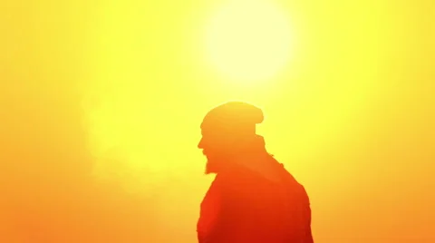 A man at sunrise trains doing exercises. Bearded man at dawn. Stock Footage 58577983