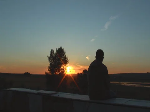 Man at sunset Stock Footage 83694330