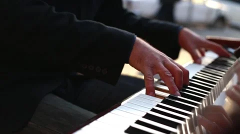 Man in the Sunset Plays Piano Stock Footage 56149963