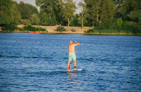 Man on a SUP board in the river Stock Photos