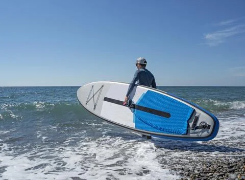 Man with SUP Fotos de archivo