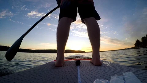 Man on sup at sunrise Stock Footage 92368640