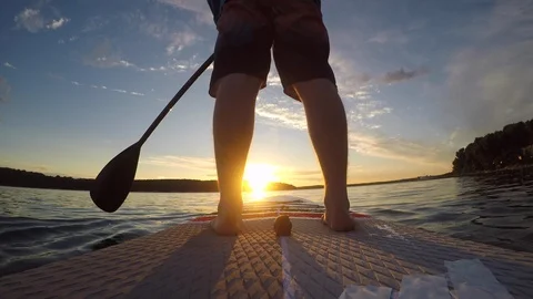 Man on sup at sunset Stock Footage 92360885