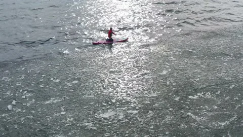 Man on supboard rowing intensely Stock Footage 189417121