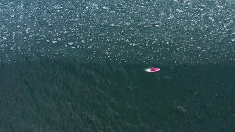 Man on supboard rowing intensely Stock Footage 191360204