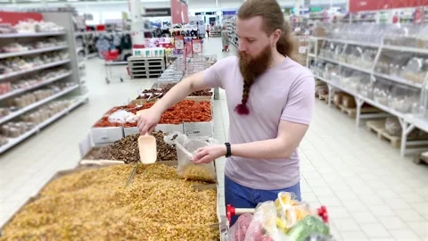Man in a supermarket Stock-Footage 277185647
