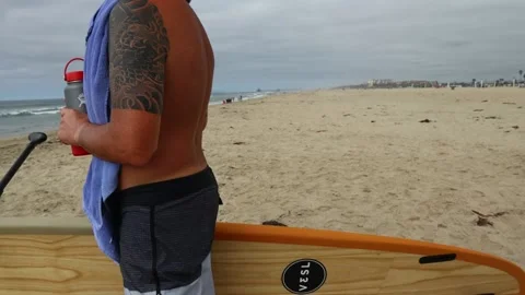 Man with Surf Board Stock Footage 141110247