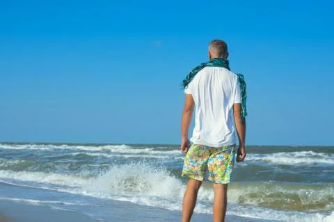 Man on the surf line Stock Photos