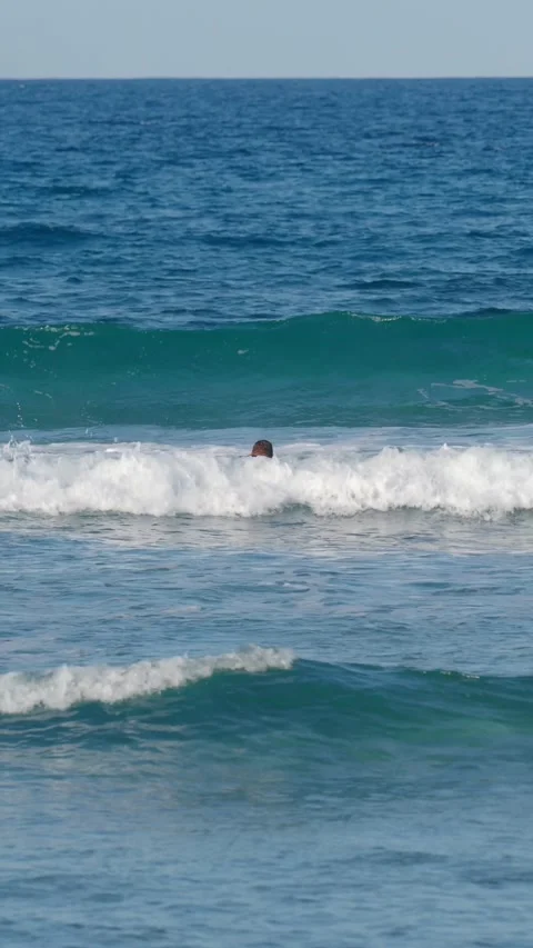 Man surfer duckdiving through a wave. Stock Footage 265889269