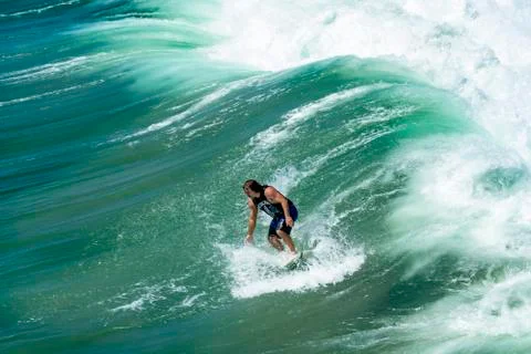 Man Surfing Dramatic Ocean Wave Stock Photos