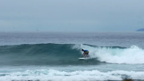 Man Surfing At Dusk Stock Footage 79737468